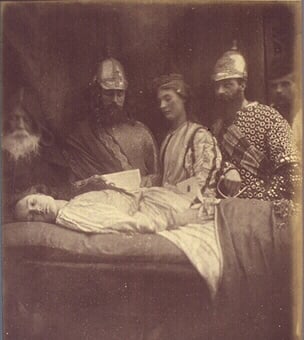 A vintage, creepy photo of a post-mortem family portrait.